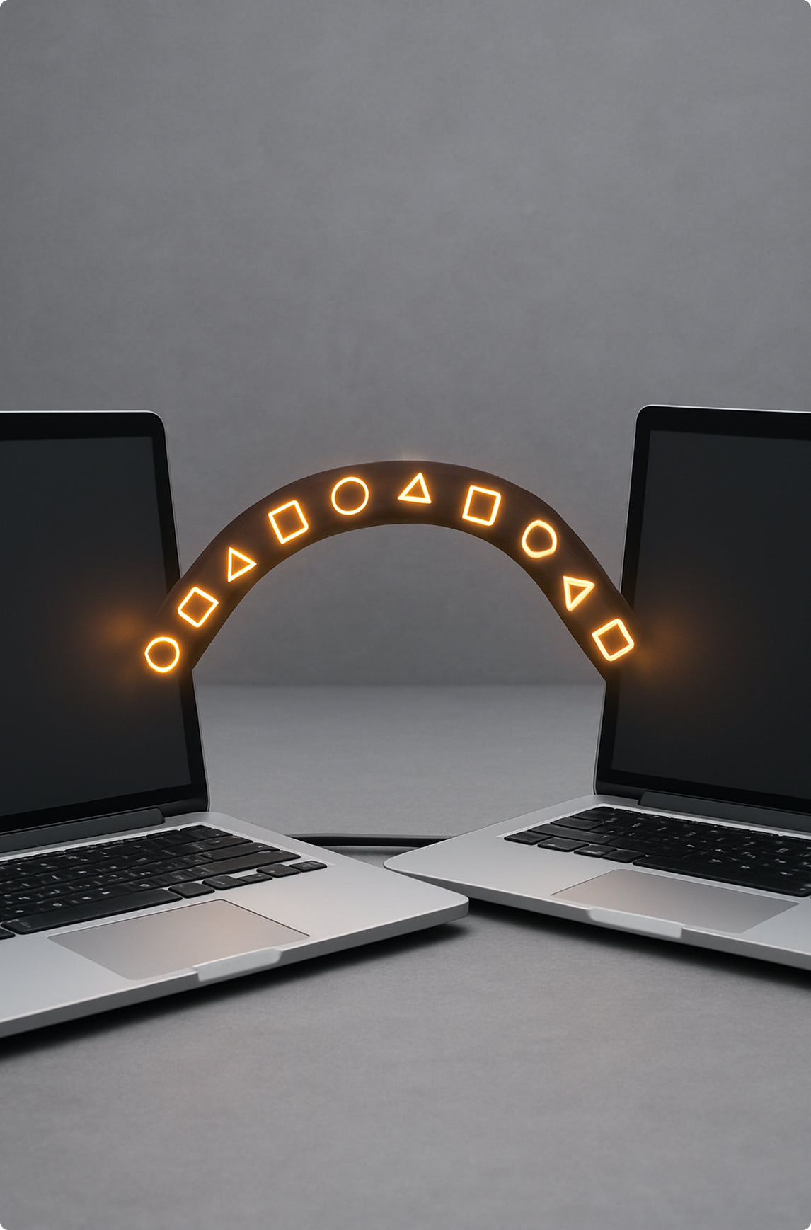 Two laptops with a glowing arch between them on a gray background migrating from old platforms to Shopify