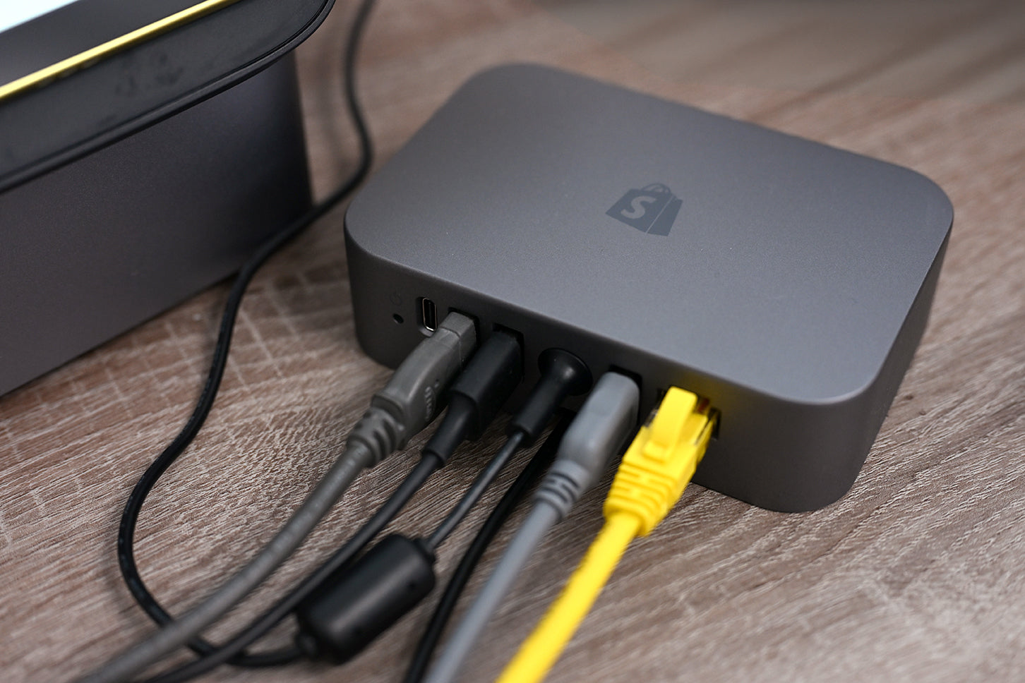 USB connections and Ethernet power the Shopify POS Hub device.